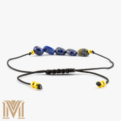 Blue gemstone bracelet with gold-tone accents