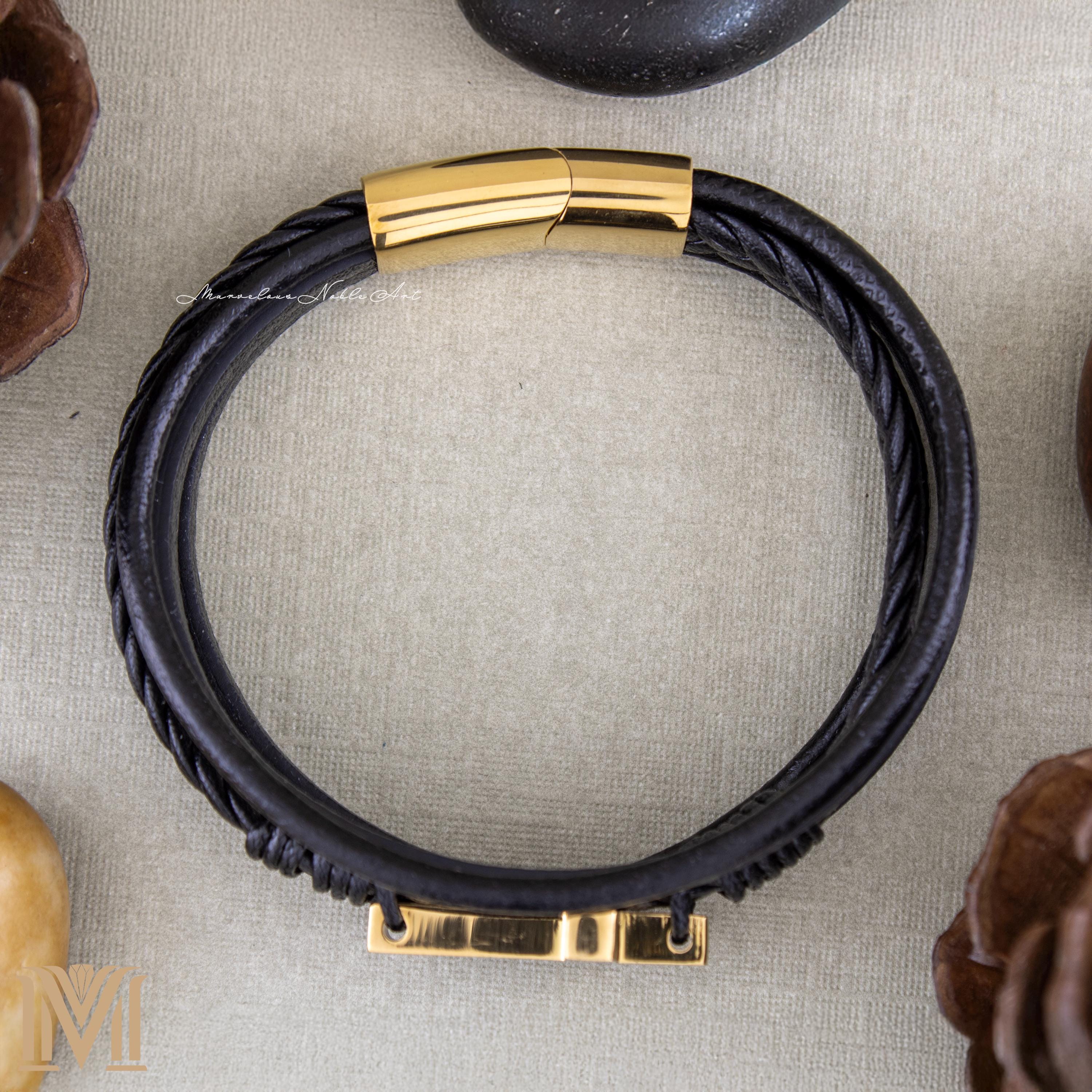 Top view of black and gold faith bracelet