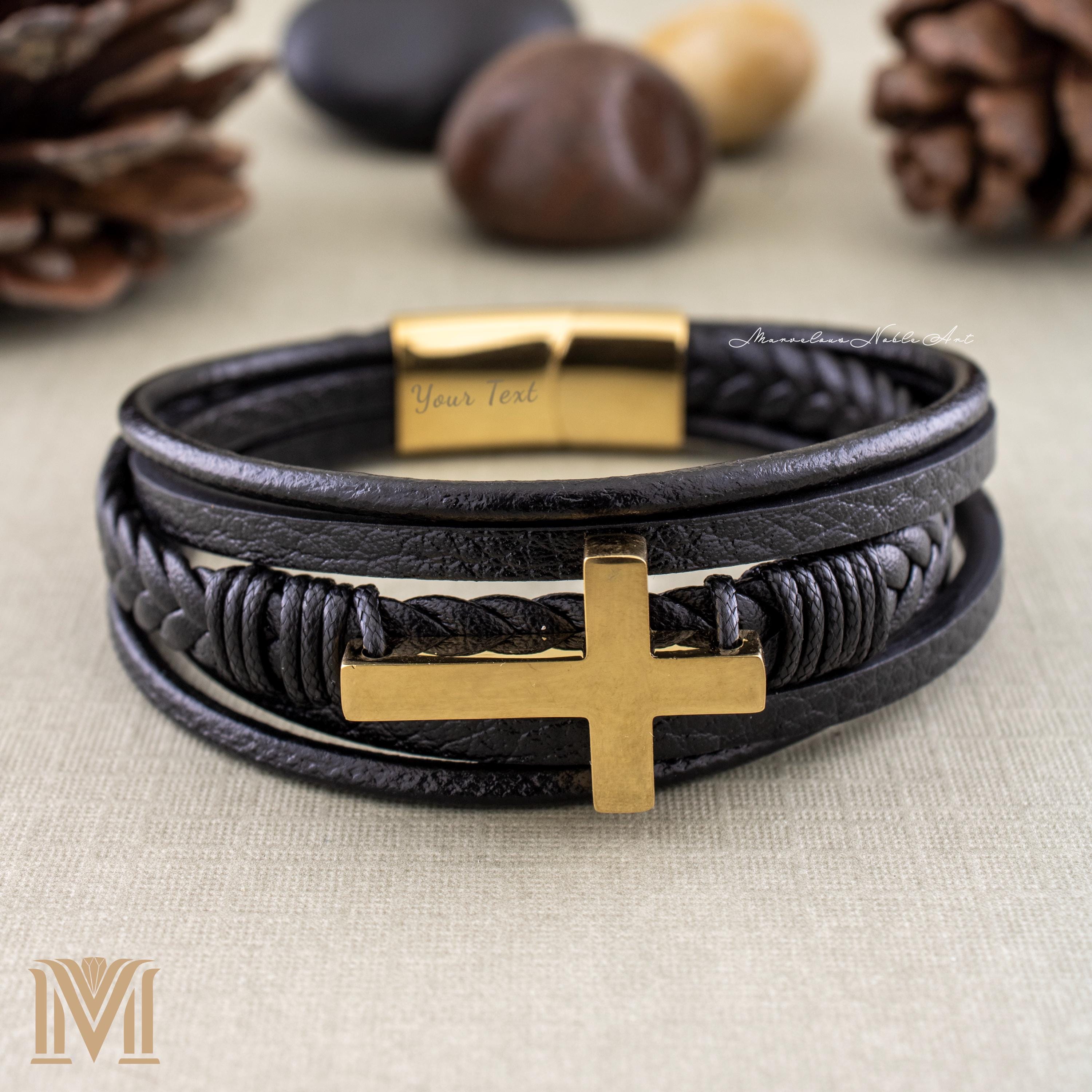 Black leather bracelet with gold cross and engraved clasp