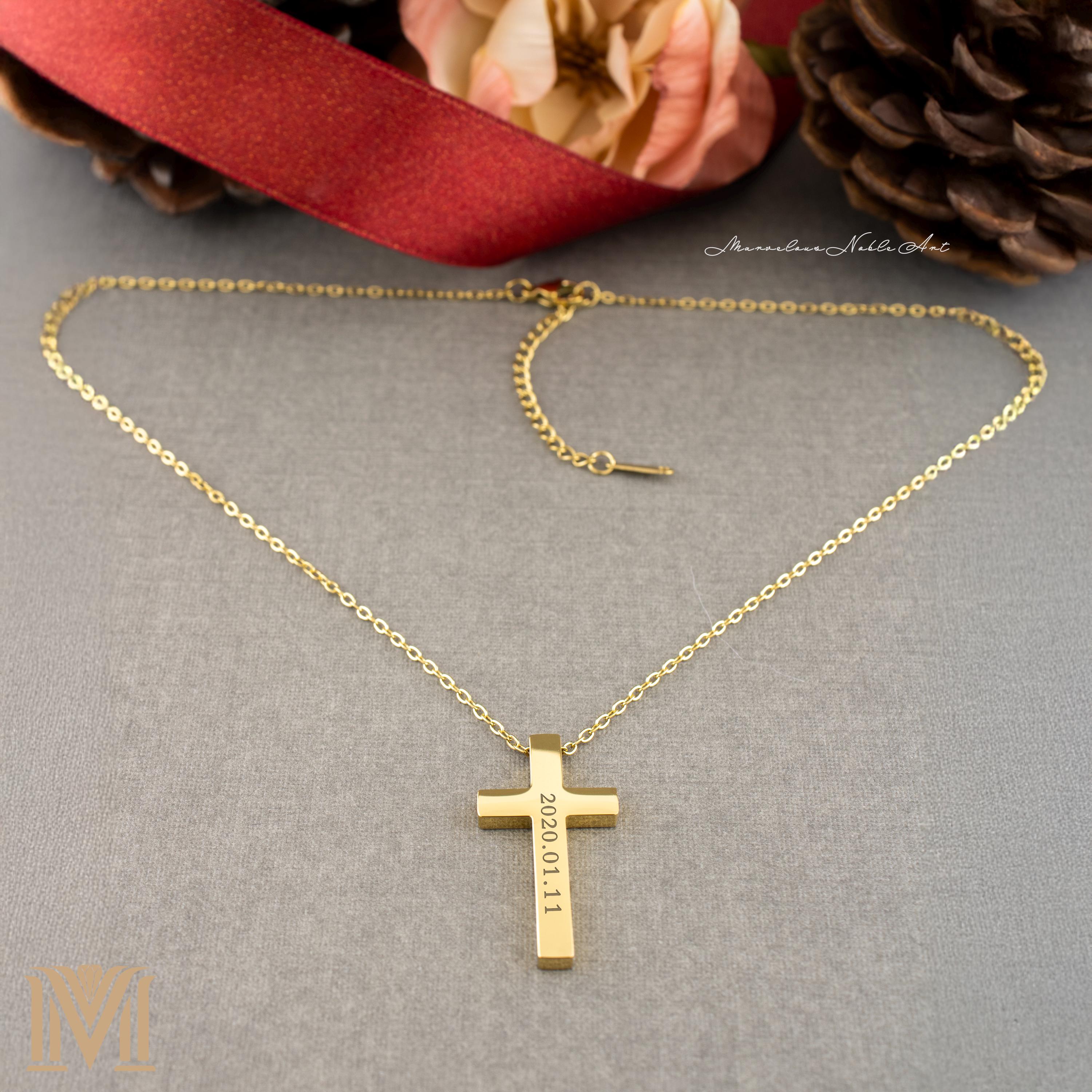Gold cross necklace with engraved date