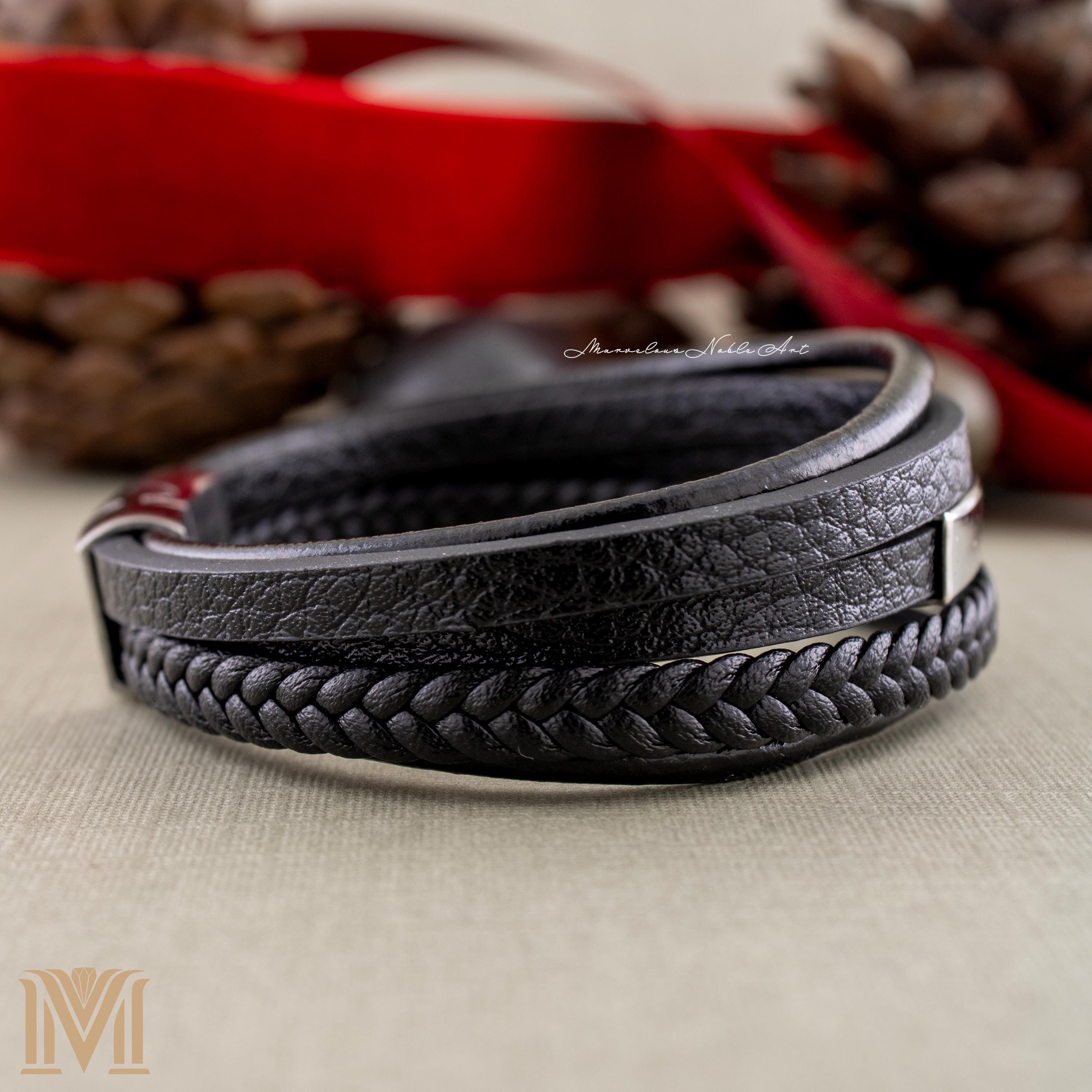 Textured black leather and stainless plate close-up