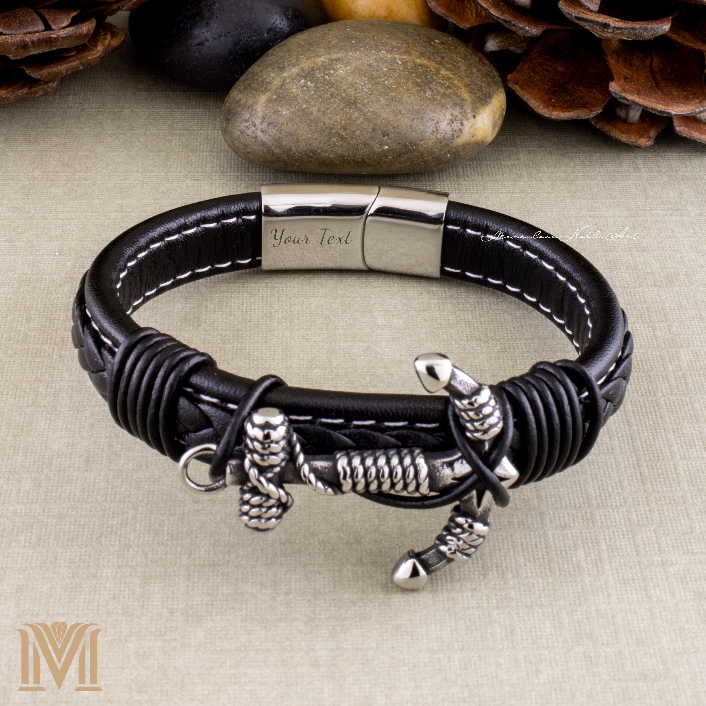 Braided black leather bracelet with silver accents