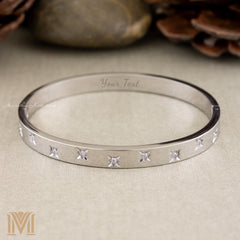 Silver star bangle front view