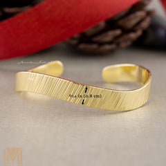 Gold cuff showing 5/16 inch width