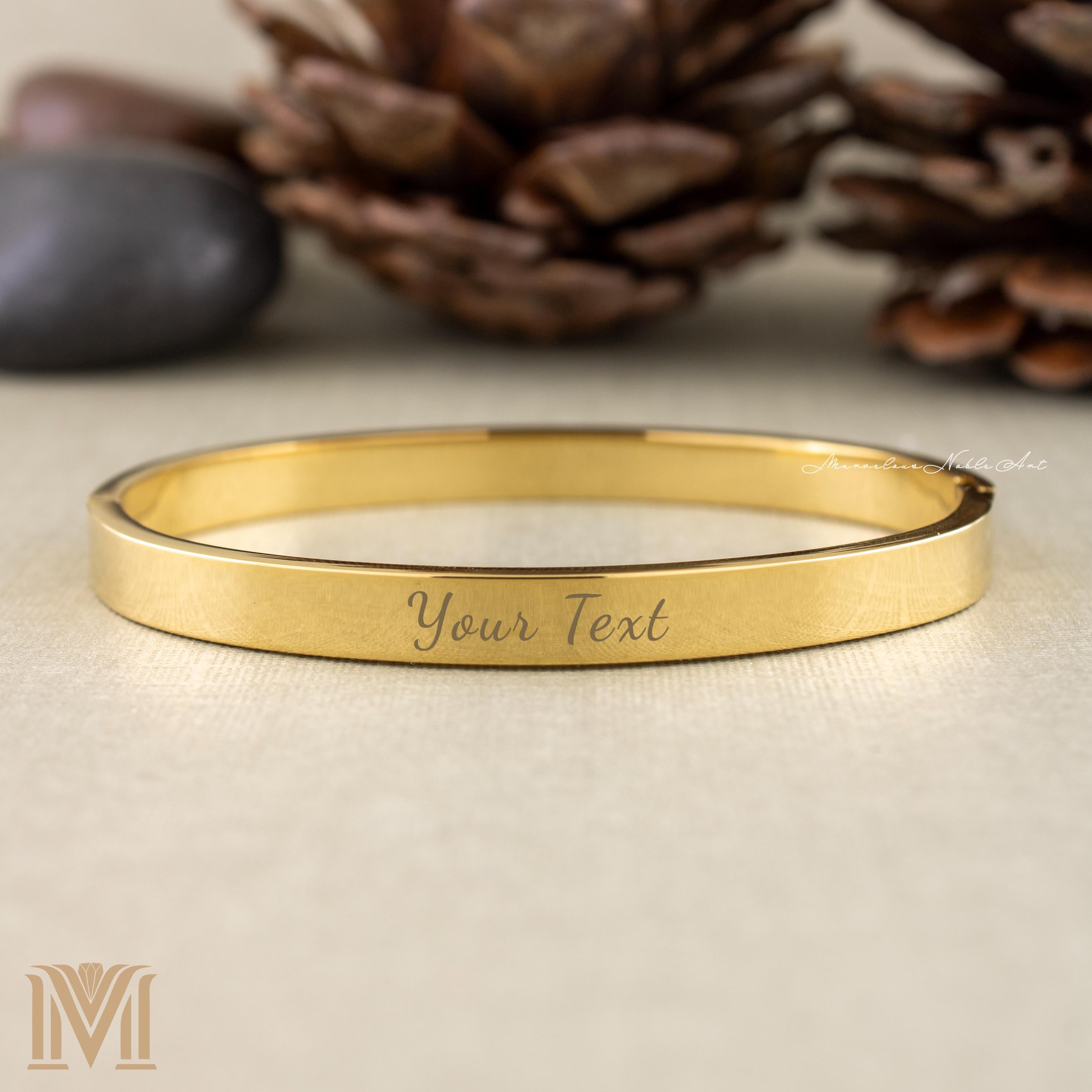 Engraved gold cuff with custom text