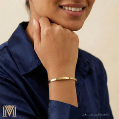Model wearing personalized gold cuff