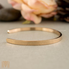 Rose gold cuff close-up