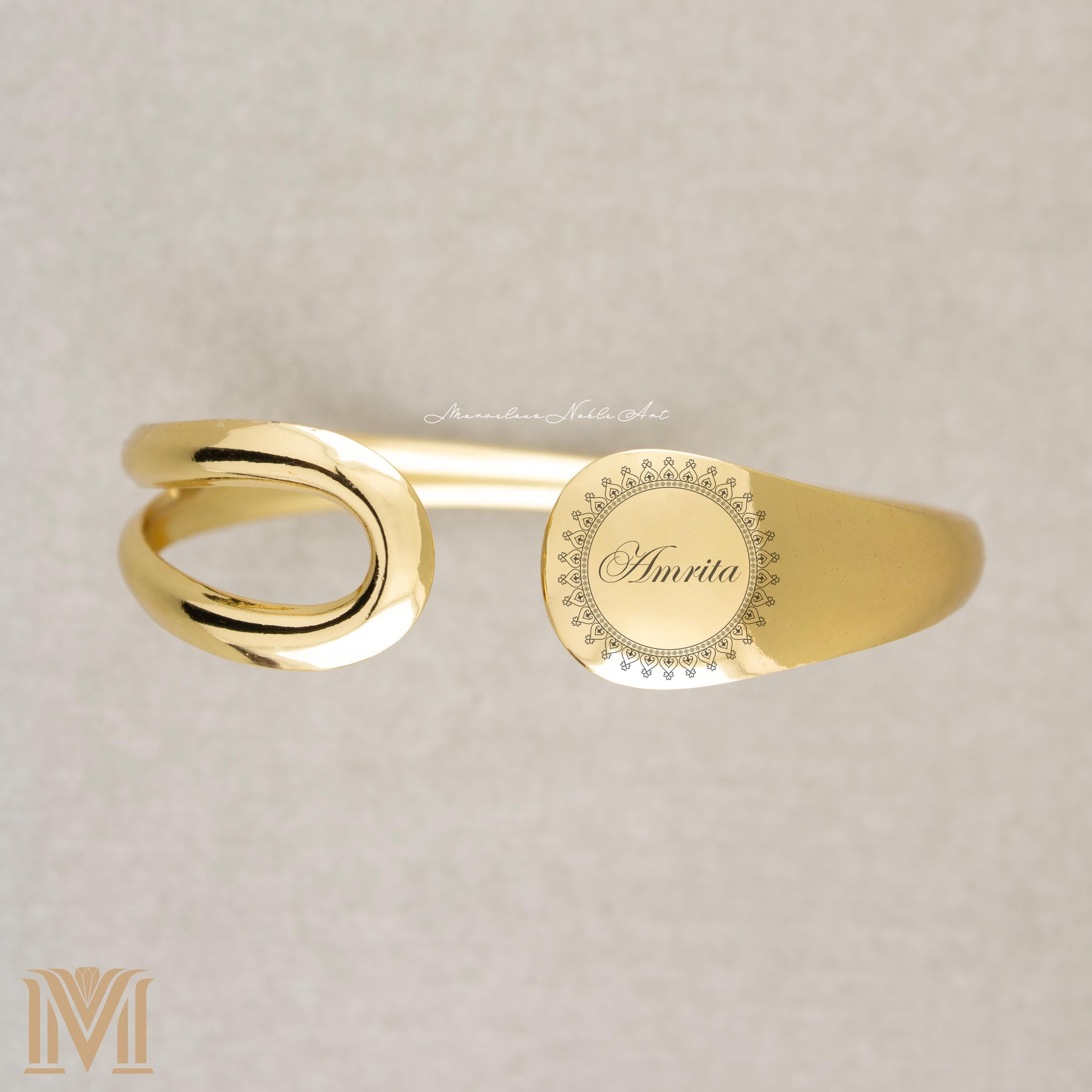 Engraved gold cuff with text
