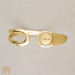 Engraved gold cuff with text