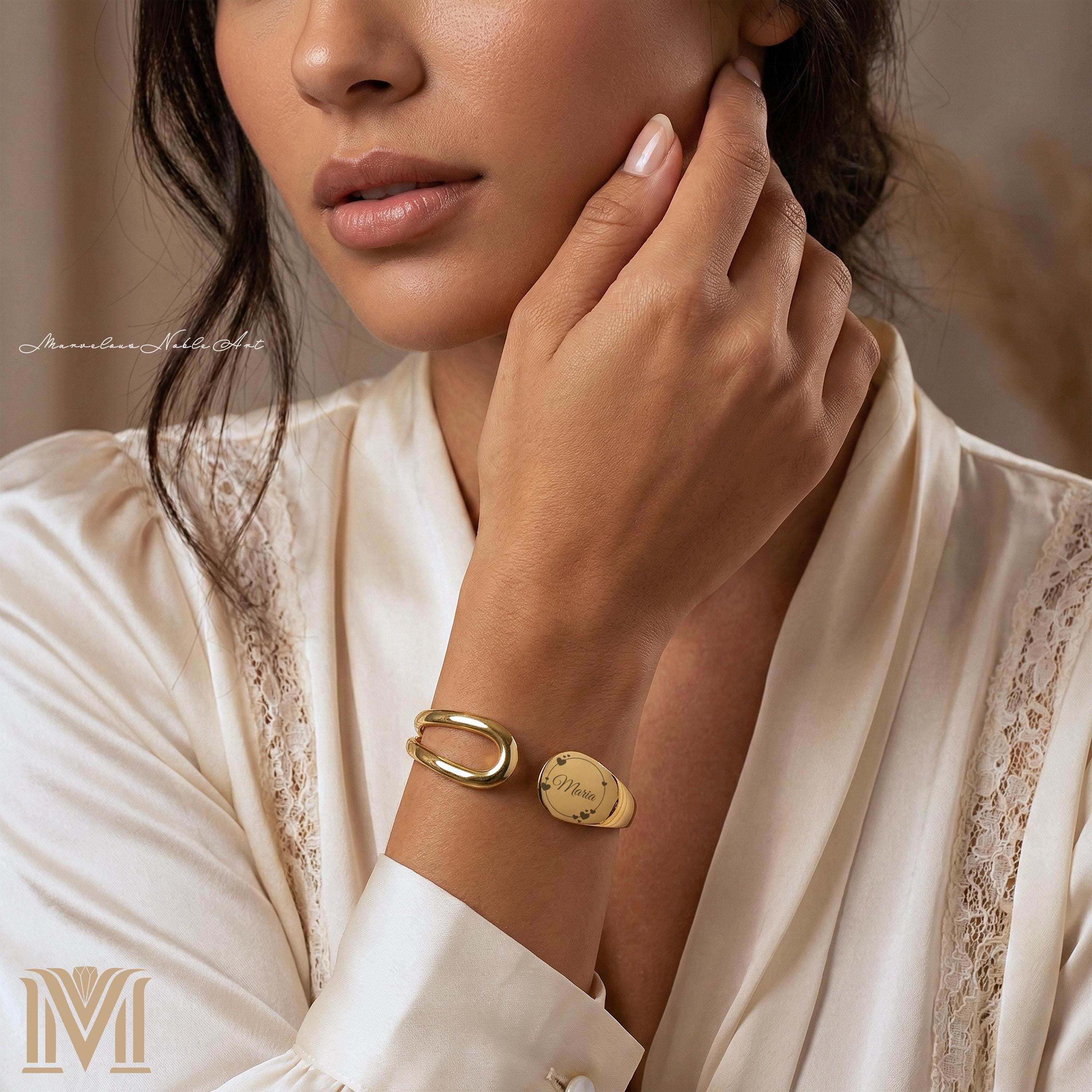 Woman wearing personalized gold open cuff bracelet
