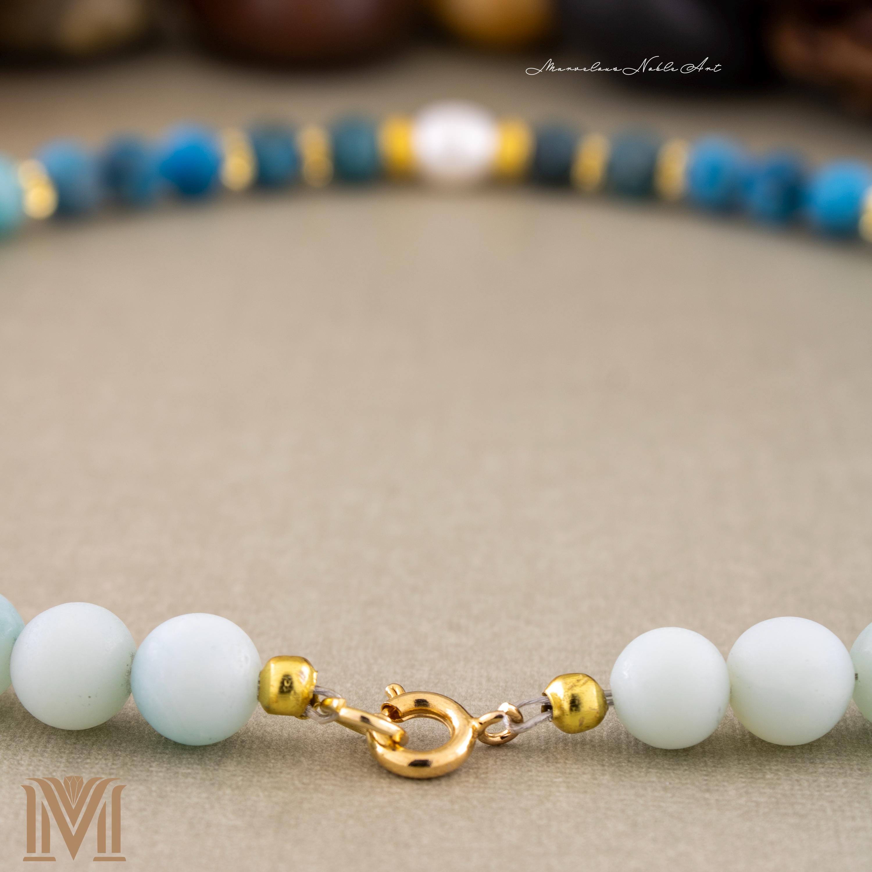 Gold-plated spring-ring clasp detail