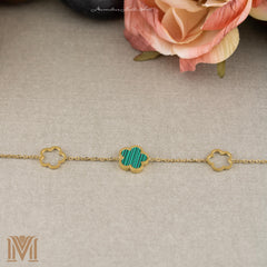 Gold flower bracelet laid flat