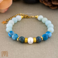 Blue gemstone bracelet with gold spacers