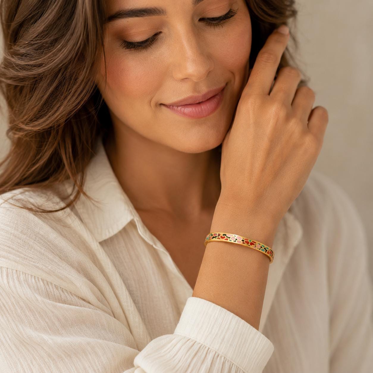 Woman wearing personalized enamel gold bangle