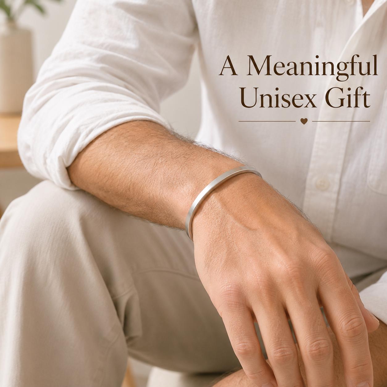 Man wearing minimalist silver stainless steel cuff