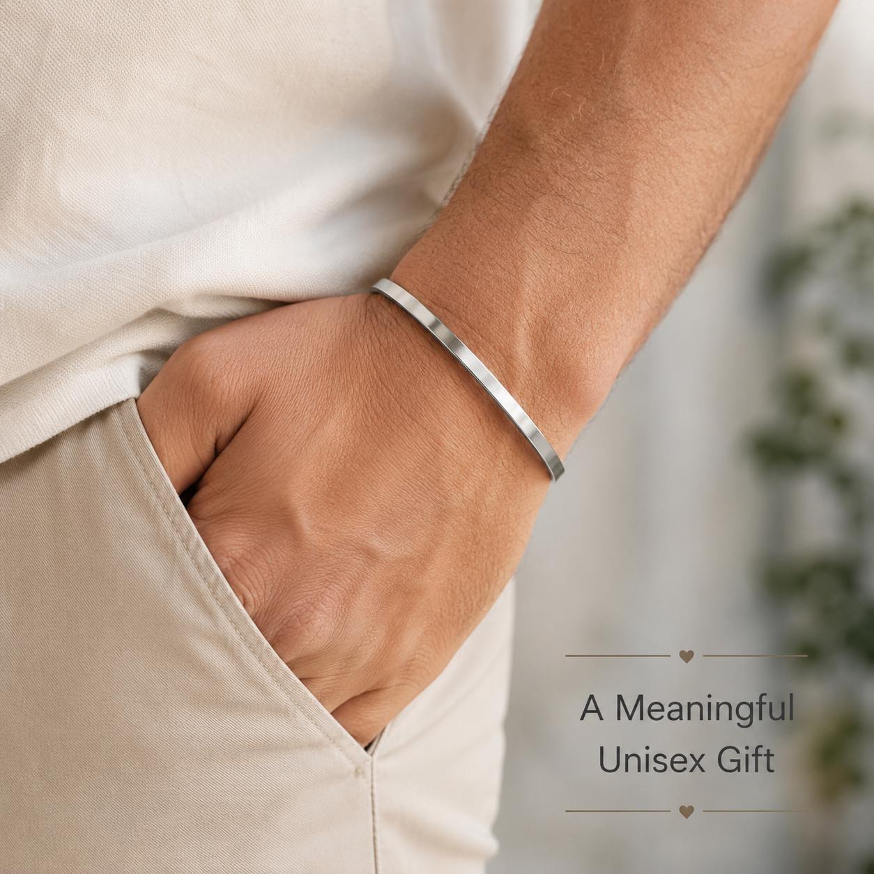 Man wearing minimalist stainless-steel cuff