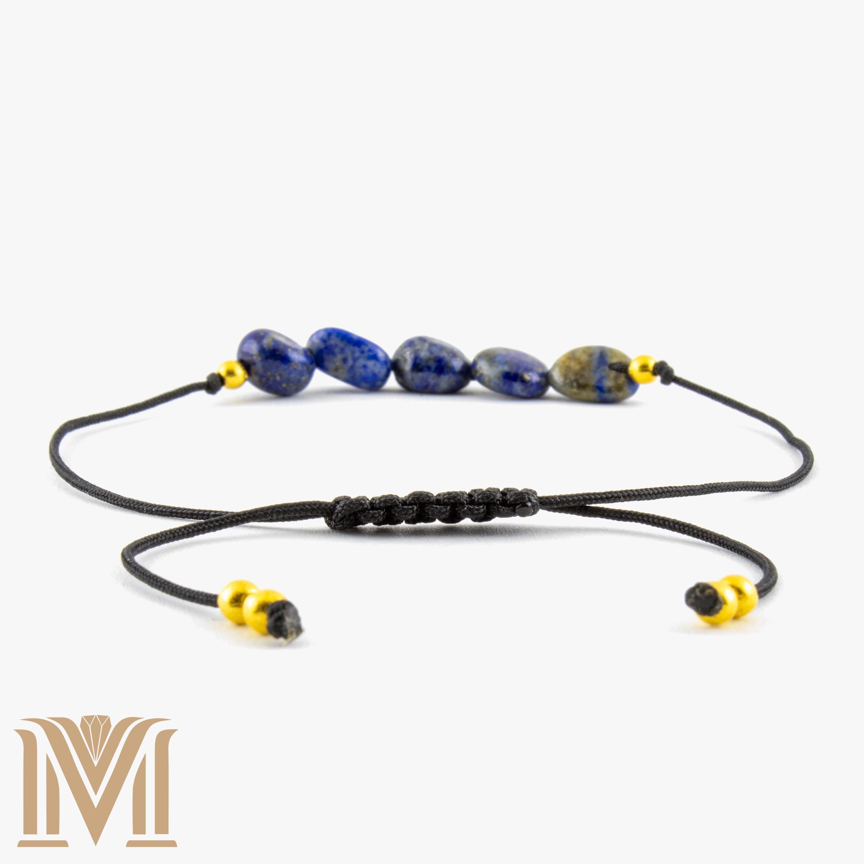 Blue gemstone bracelet with gold-tone accents