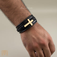 Male model wearing personalized leather cross bracelet