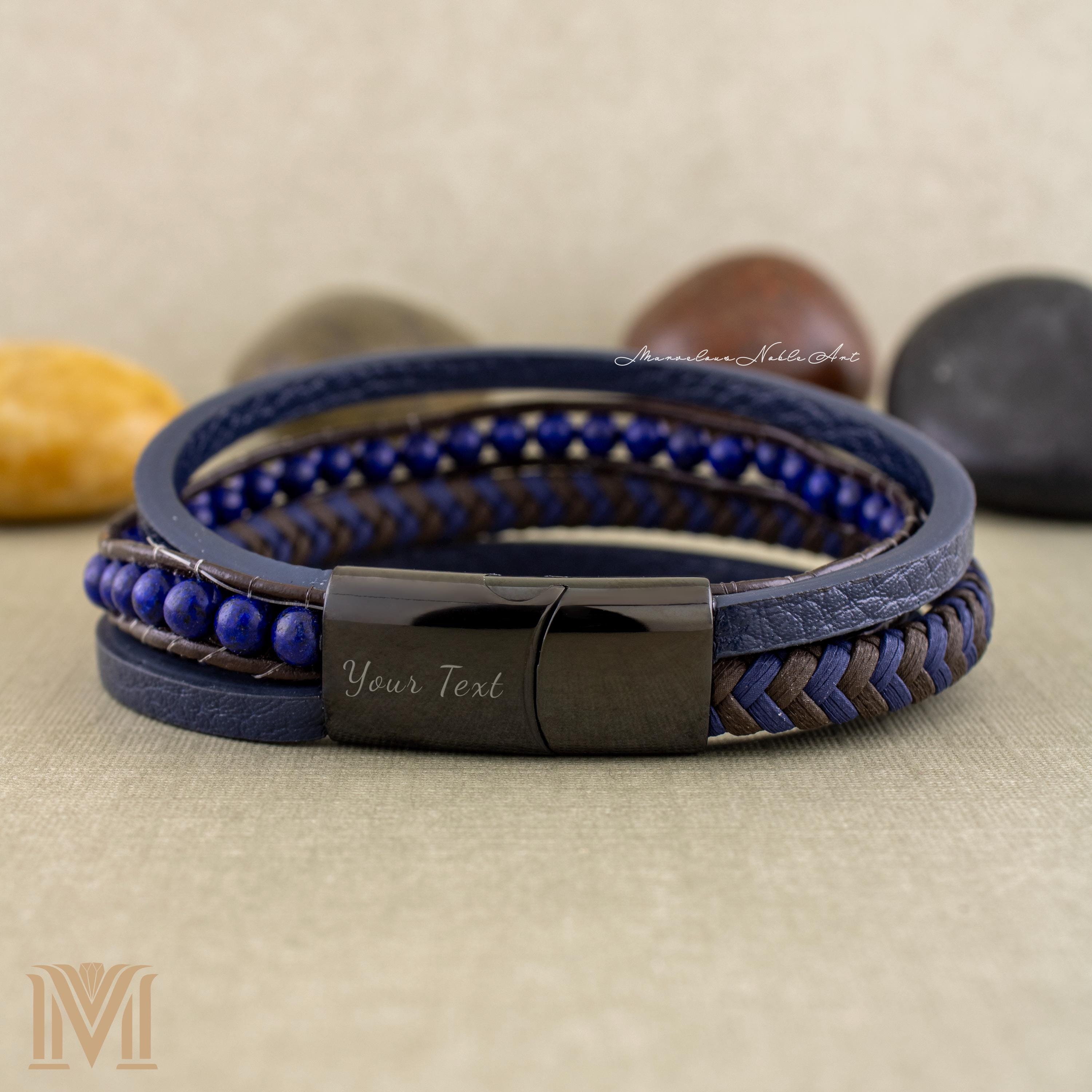 Custom engraved magnetic clasp on navy leather bracelet