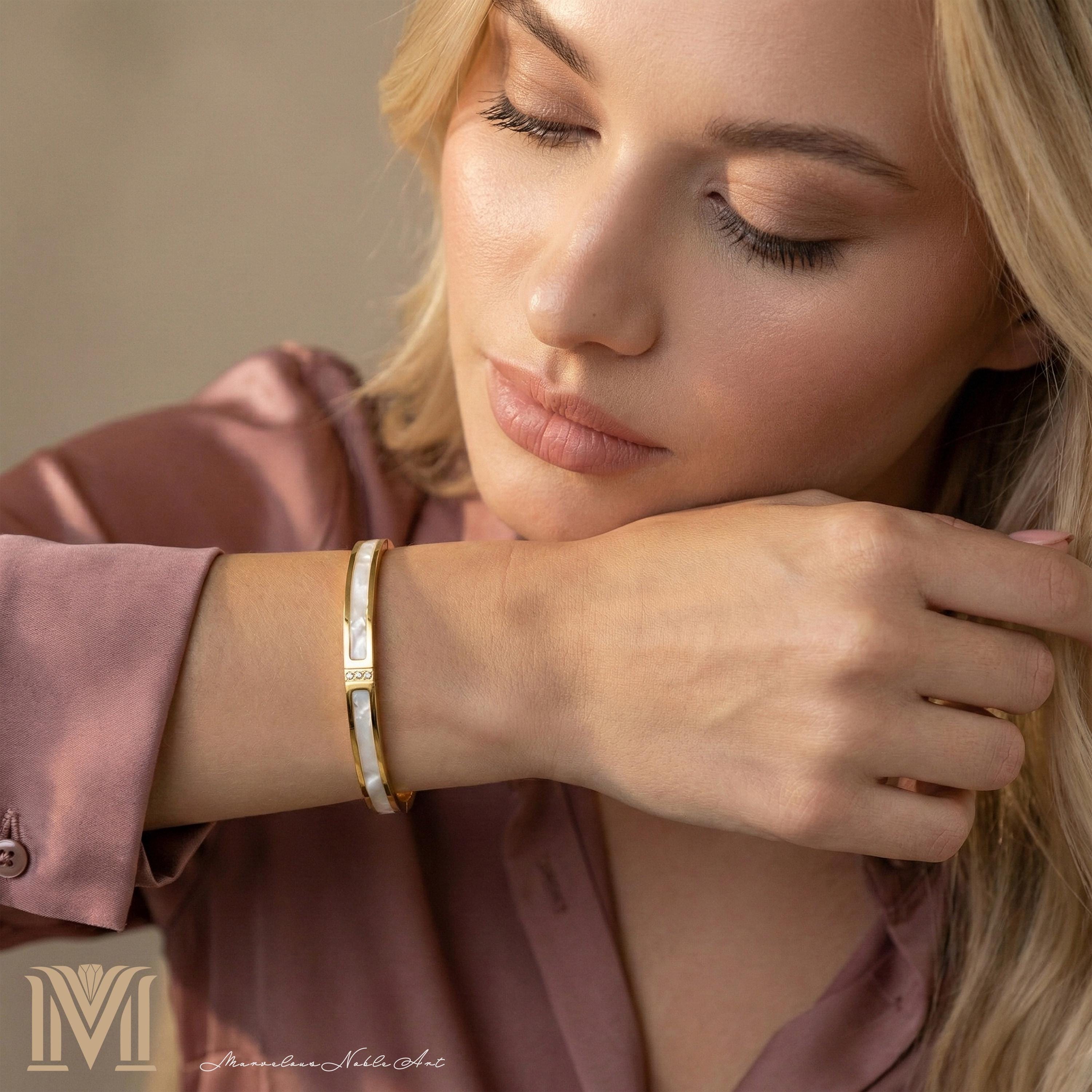 Model wearing gold bracelet
