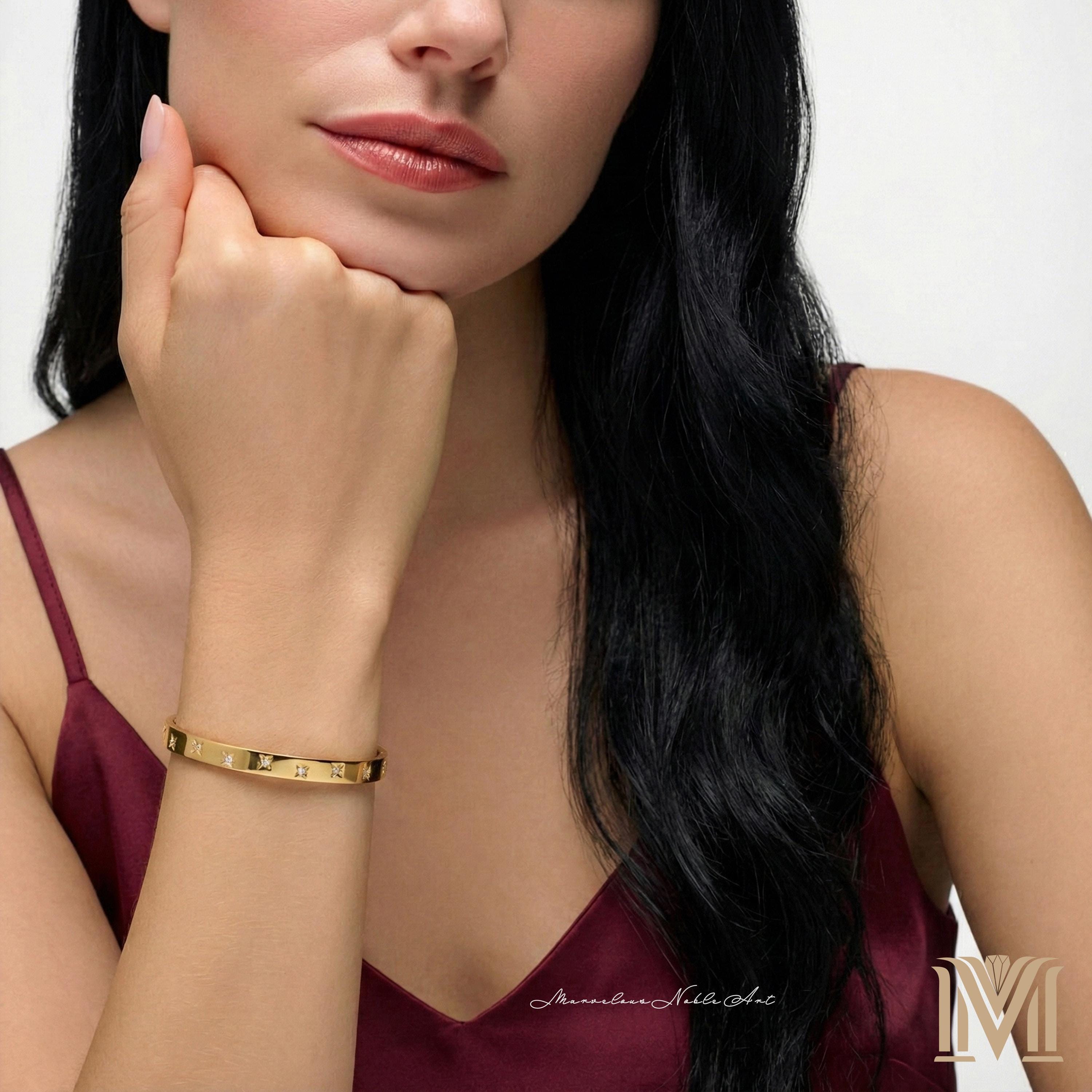 Gold bangle worn on wrist