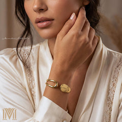 Woman wearing personalized gold open cuff bracelet