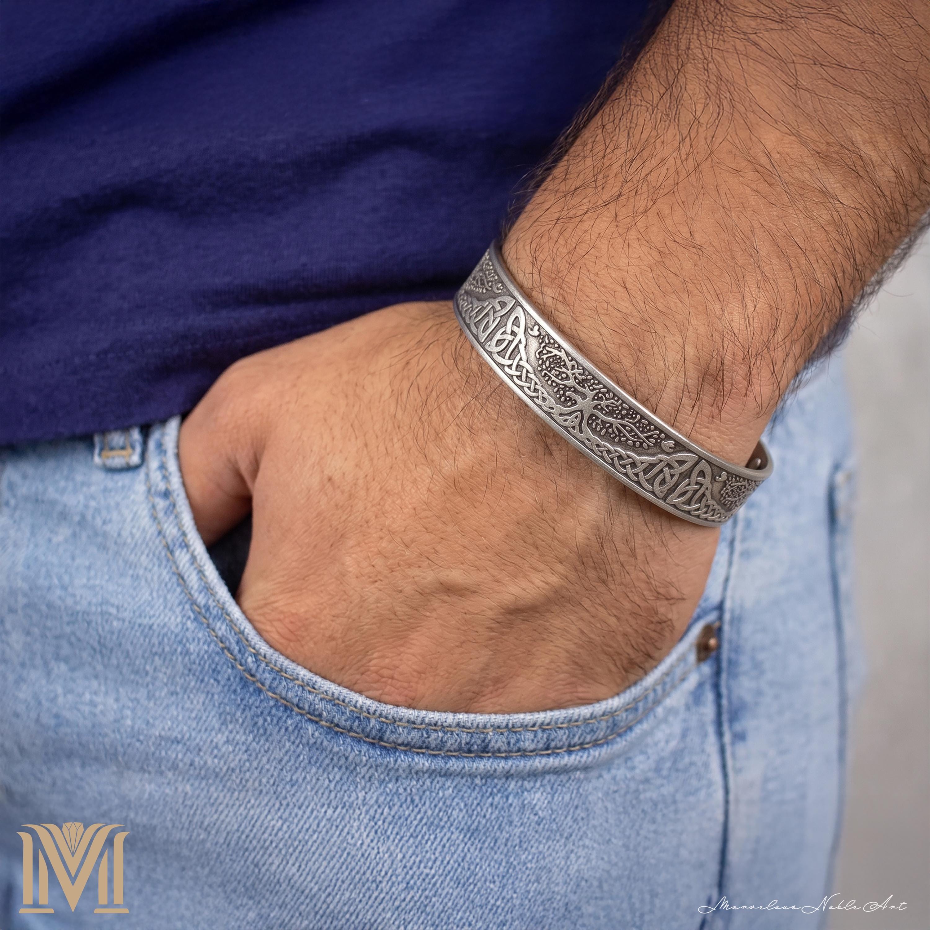 Man wearing Tree of Life cuff