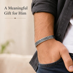 Man wearing stainless steel Celtic cuff