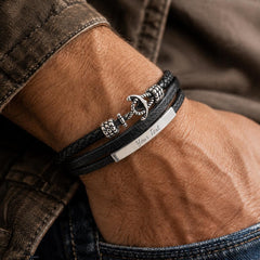 Male model wearing personalized black leather anchor bracelet