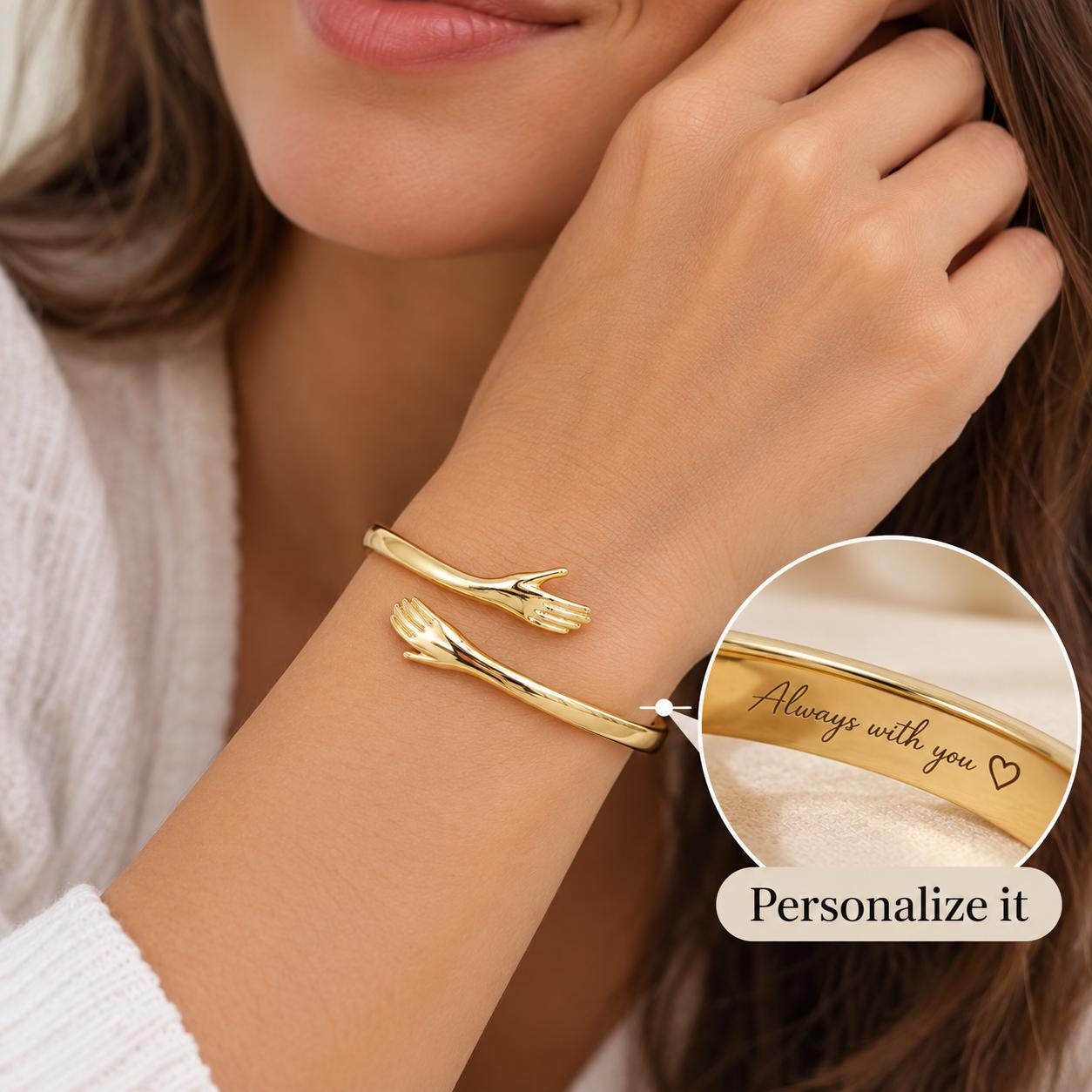 Personalized gold hug cuff worn on wrist with engraving detail