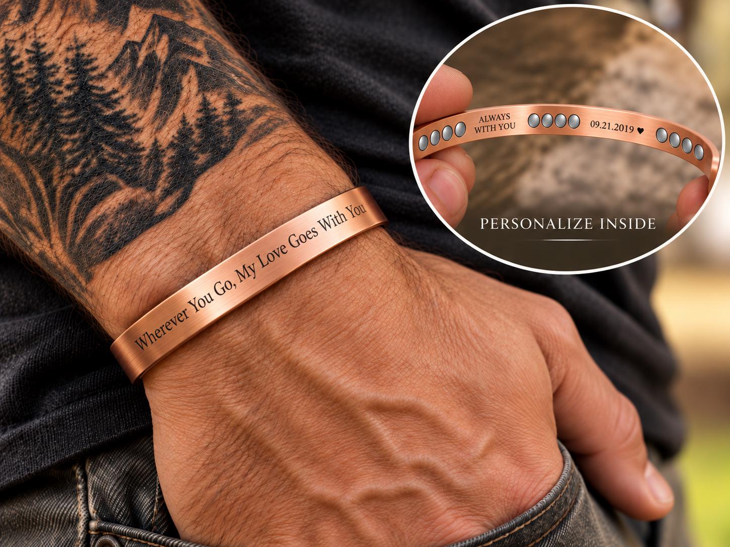 Tattooed man wearing personalized pure copper cuff with engraving inset